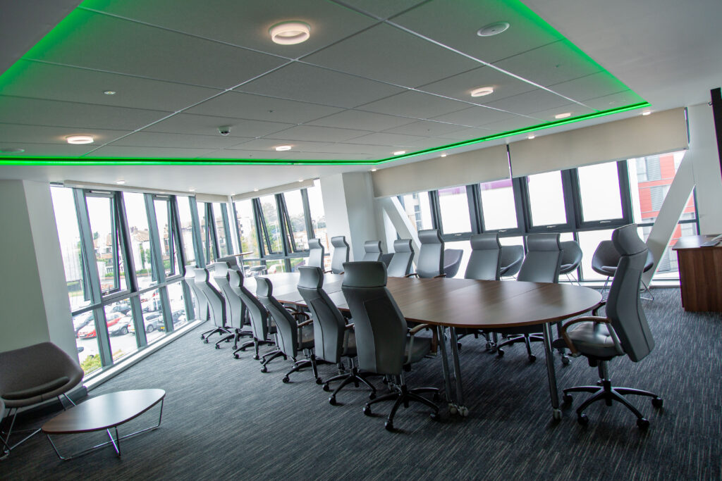 The Pinnacle Suite set out with tables and chairs in a boardroom style.